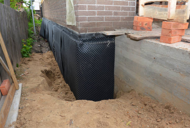 Happy homeowners after waterproofing job in Scotland